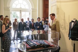 Event Party : WASHINGTON, DC - MAY 14: Nick Foulkes, (R) curator of the exhibition, gives a tour to attendees at Savile Row Bespoke and America at the British Ambassador's Residence on May 14, 2015 in Washington, DC. (Photo by Greg Kahn/Getty Images for The British Embassy)