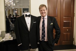 Event Party : WASHINGTON, DC - MAY 14: Elijah Duckworth-Schachter in front of his grandfather, Benny Goodman’s dinner suit at the Savile Row and America exhibition in Washington DC.  Goodman ordered seven dinner suits during his patronage of Huntsman, wearing them regularly on stage and screen.(Photo by Greg Kahn/Getty Images for The British Embassy)